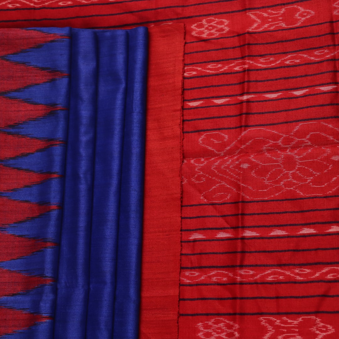 Close-up of the smooth, textured fabric of the blue Tussar silk saree.