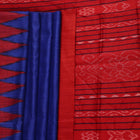 Close-up of the smooth, textured fabric of the blue Tussar silk saree.