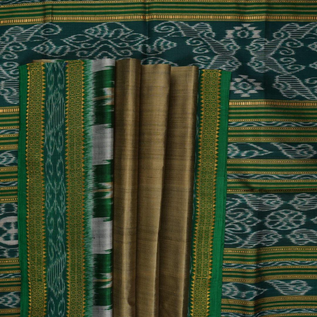Elegant styling of a brown and green Khandua silk saree with butta work as draped on a model.