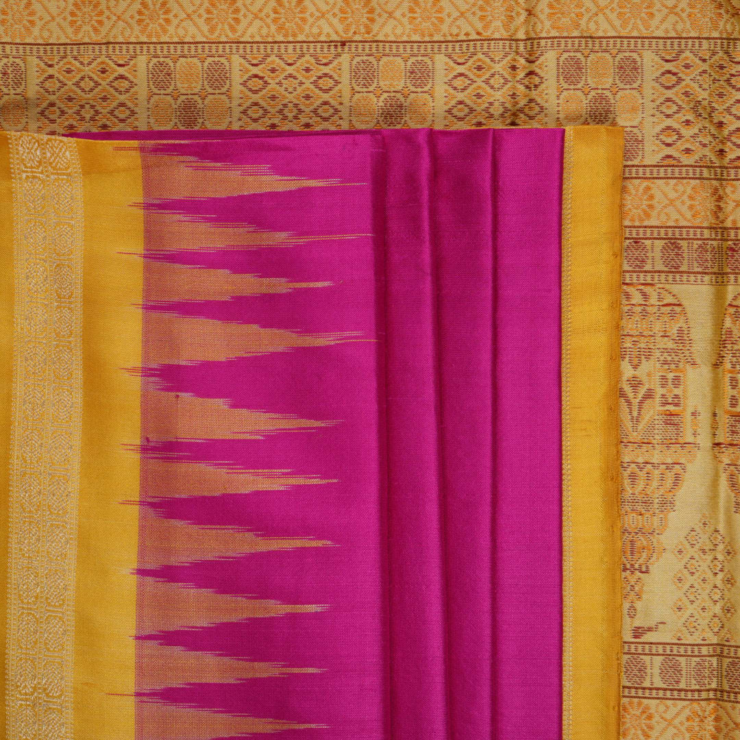 Close-up of the luxurious Bomkai silk saree fabric texture and weave in pink and yellow.