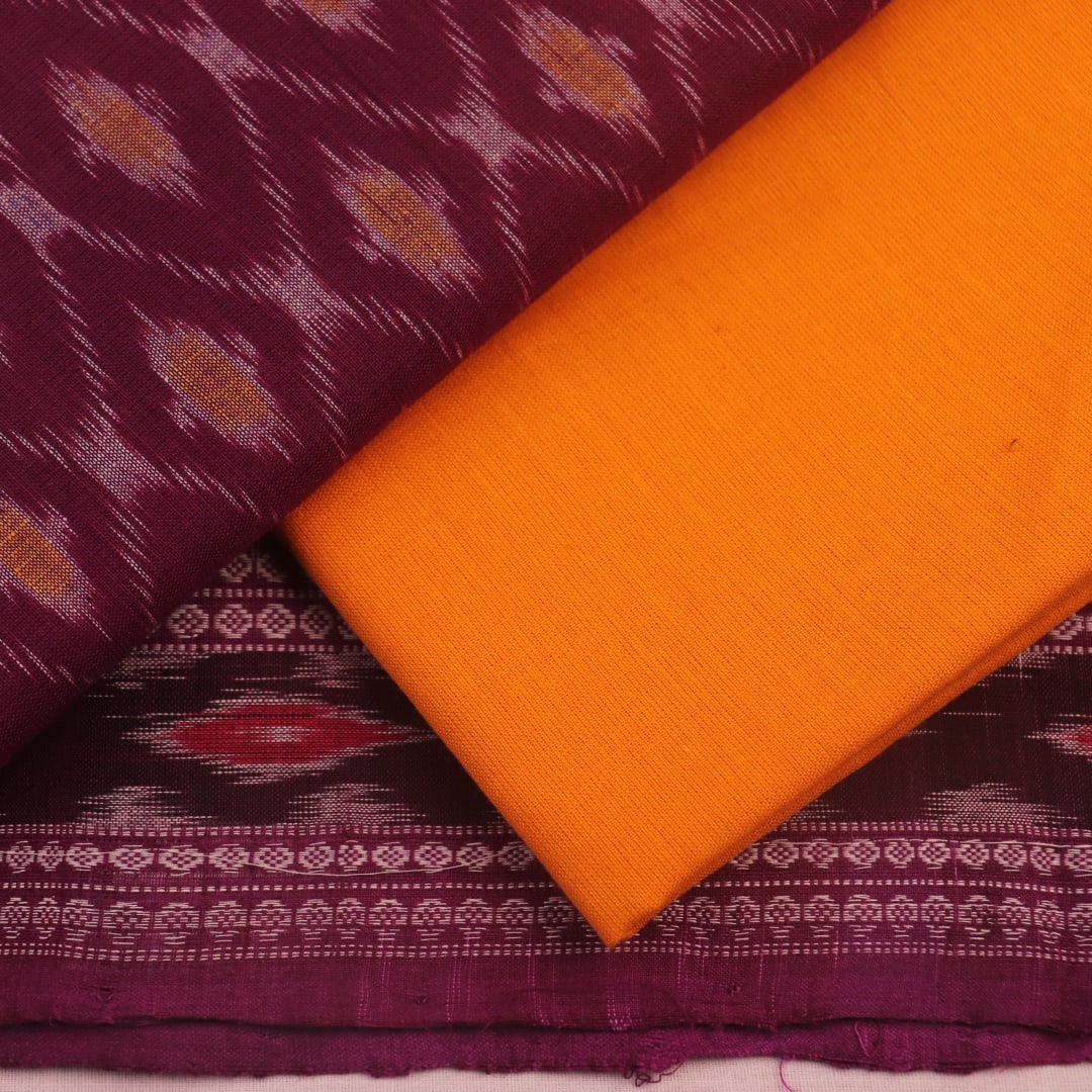 Close-up of purple and yellow motifs on Sambalpuri cotton dress material body.