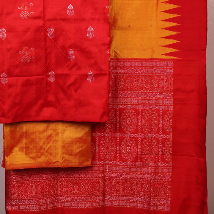 Red and yellow Bomkai silk dress material blouse piece with butta pattern.