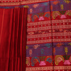 Close-up of maroon plain Sambalpuri silk saree fabric texture.