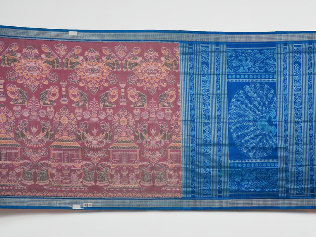 Close-up of the multi-color blue Sambalpuri silk saree fabric texture, highlighting intricate weave.