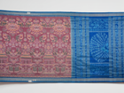 Close-up of the multi-color blue Sambalpuri silk saree fabric texture, highlighting intricate weave.