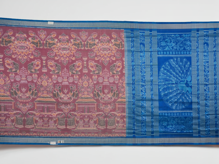 Close-up of the multi-color blue Sambalpuri silk saree fabric texture, highlighting intricate weave.