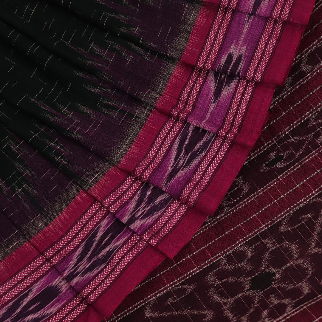 A model drapes an elegant green and magenta Sambalpuri cotton saree with a Pasapalli pattern, showcasing its intricate design and flowing form.