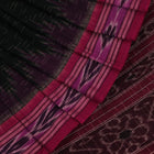 A model drapes an elegant green and magenta Sambalpuri cotton saree with a Pasapalli pattern, showcasing its intricate design and flowing form.