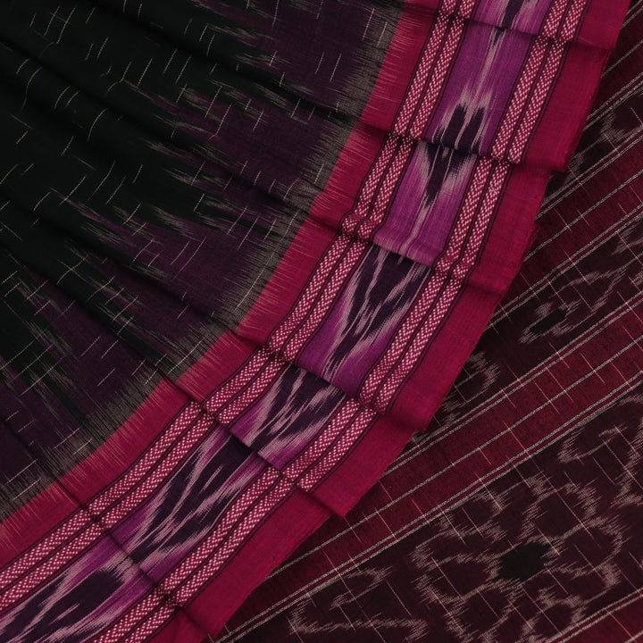 A model drapes an elegant green and magenta Sambalpuri cotton saree with a Pasapalli pattern, showcasing its intricate design and flowing form.