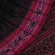 A model drapes an elegant green and magenta Sambalpuri cotton saree with a Pasapalli pattern, showcasing its intricate design and flowing form.