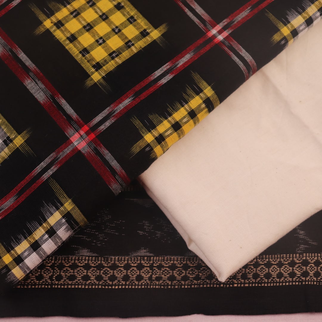 Detail of the black and white Sambalpuri cotton dress material's blouse piece with motifs.