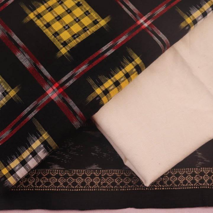 Detail of the black and white Sambalpuri cotton dress material's blouse piece with motifs.