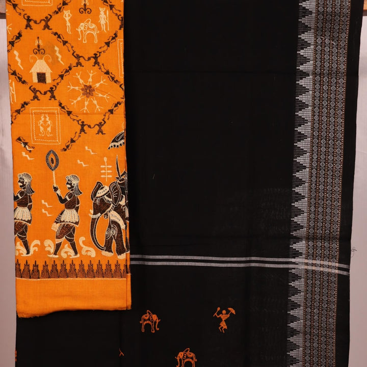 Close-up of blouse piece design featuring a doll pattern in yellow and black cotton Sambalpuri dress material