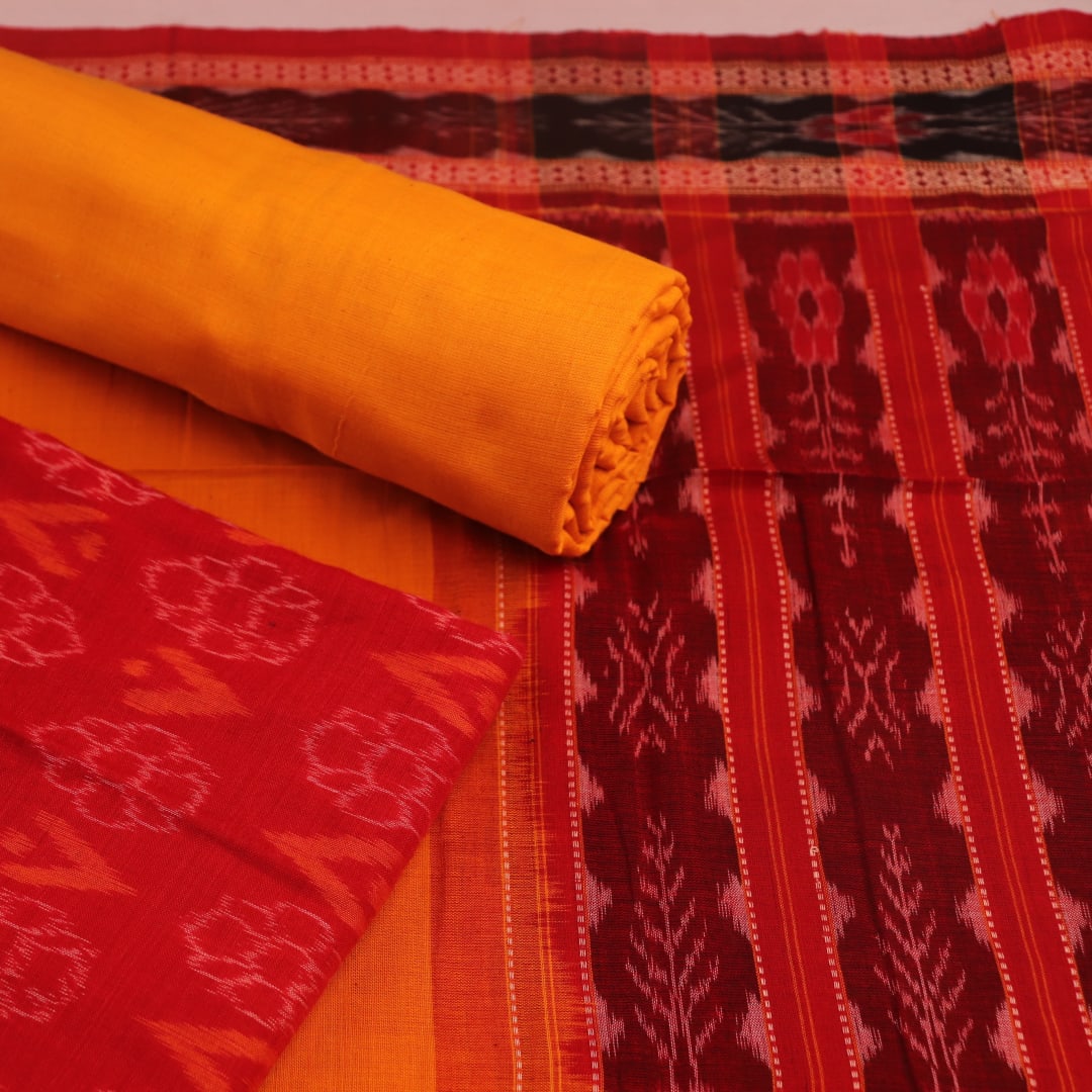 Detail of red and yellow Sambalpuri cotton dress material blouse piece, featuring motifs.