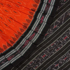 Model wearing an orange and black Sambalpuri cotton saree, styled in an elegant traditional drape.