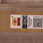 Close-up view of the grey tussar silk fabric texture with subtle butta patterns