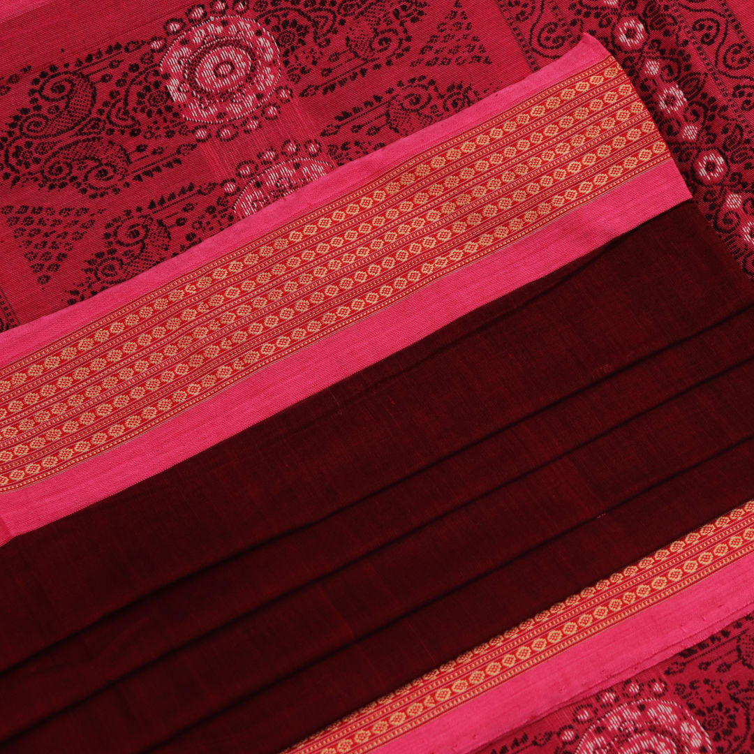 Full view of a maroon and pink cotton Bomkai saree featuring a butta pattern.