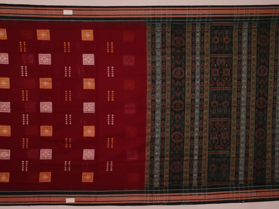 Full view of a maroon cotton Bomkai saree with green butta pattern throughout.