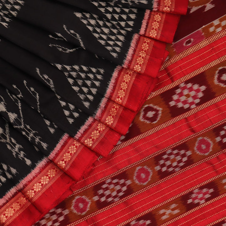 Full view of a black Khandua silk saree with red motifs.