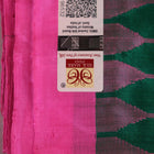 Close-up of plain green and pink Sambalpuri silk saree fabric texture.