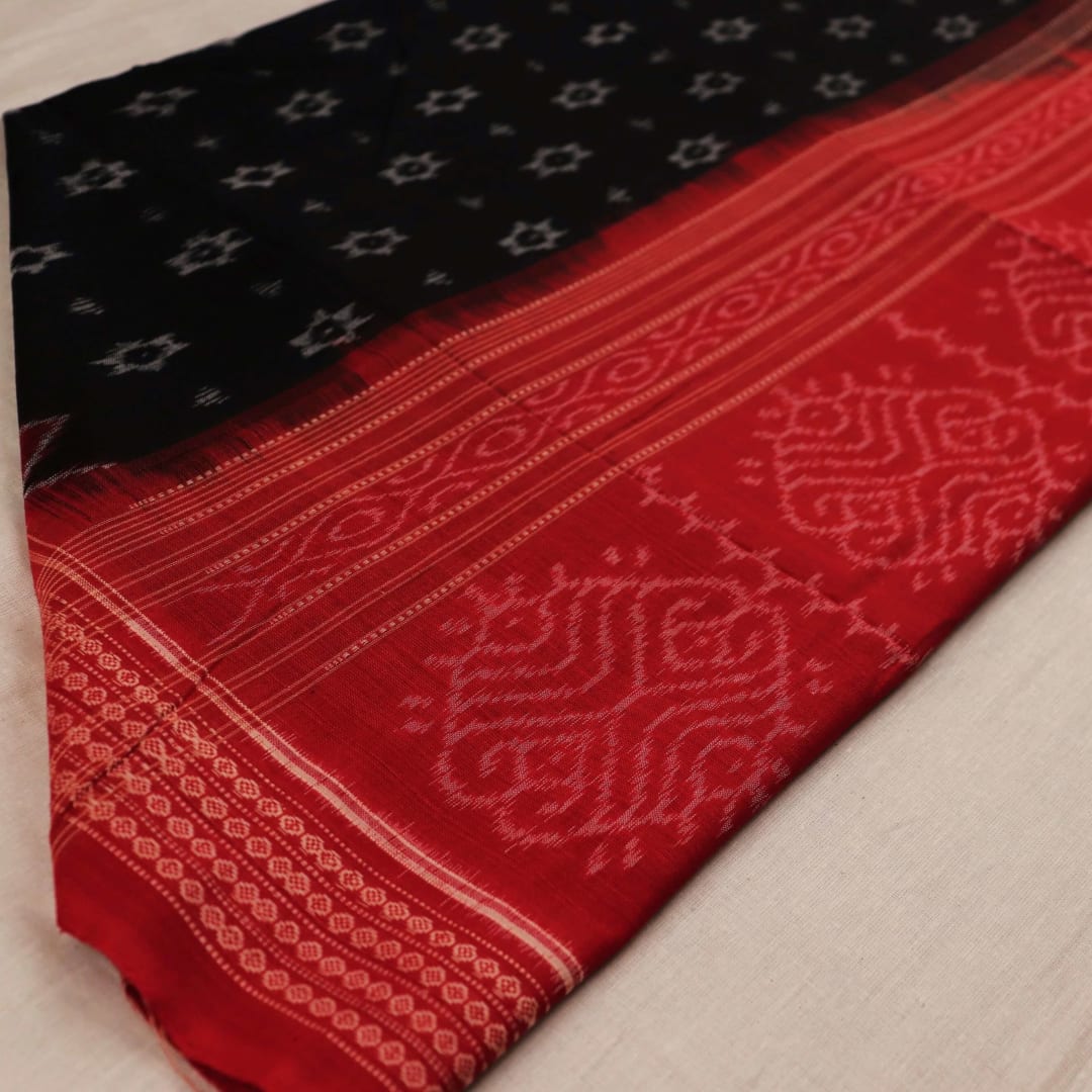 Stylish black dupatta with red motifs, draped elegantly on a model.