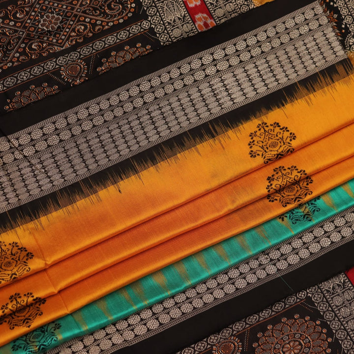 Close-up of yellow silk Bomkai saree fabric with black butta pattern