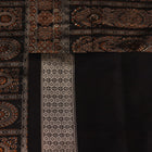Close-up of the intricate woven texture of blue and black Bomkai silk saree with butta.