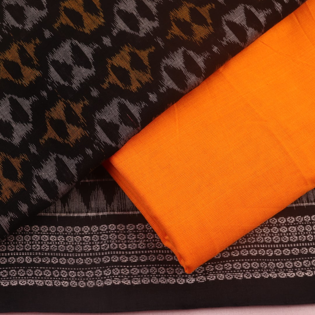 Detail of black and yellow Sambalpuri cotton dress material blouse piece with motifs.