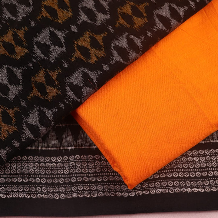 Detail of black and yellow Sambalpuri cotton dress material blouse piece with motifs.