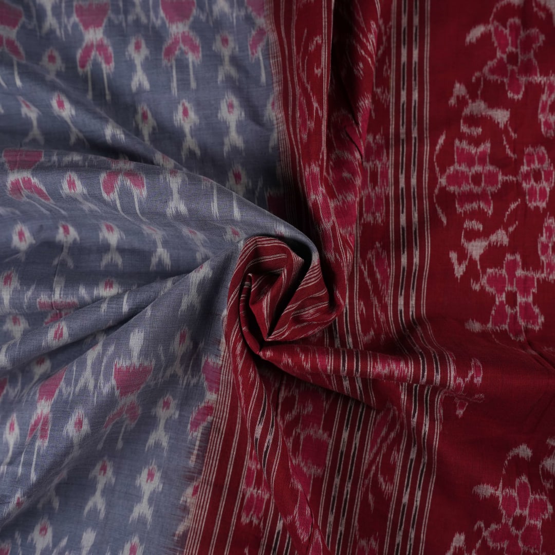 Elegant styling of a grey and maroon Sambalpuri cotton saree with hand-woven ikat motifs draped on a model.