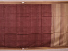Close-up of maroon Tussar silk saree fabric, showing natural slub texture and printed pattern.