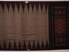 Styled view of a plain grey and black Sambalpuri cotton handloom saree.