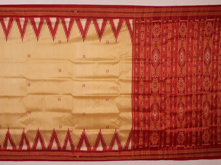Saree styling: Cream Khandua silk saree with maroon butta pattern draped elegantly.