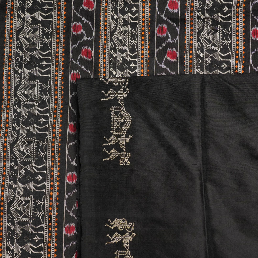 Macro close-up of Bomkai Silk Saree fabric, showing intricate brown & black silk weave.