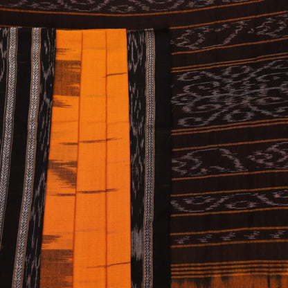 Draped view of a yellow and black Sambalpuri cotton saree with motifs, showcasing its styling and fall.