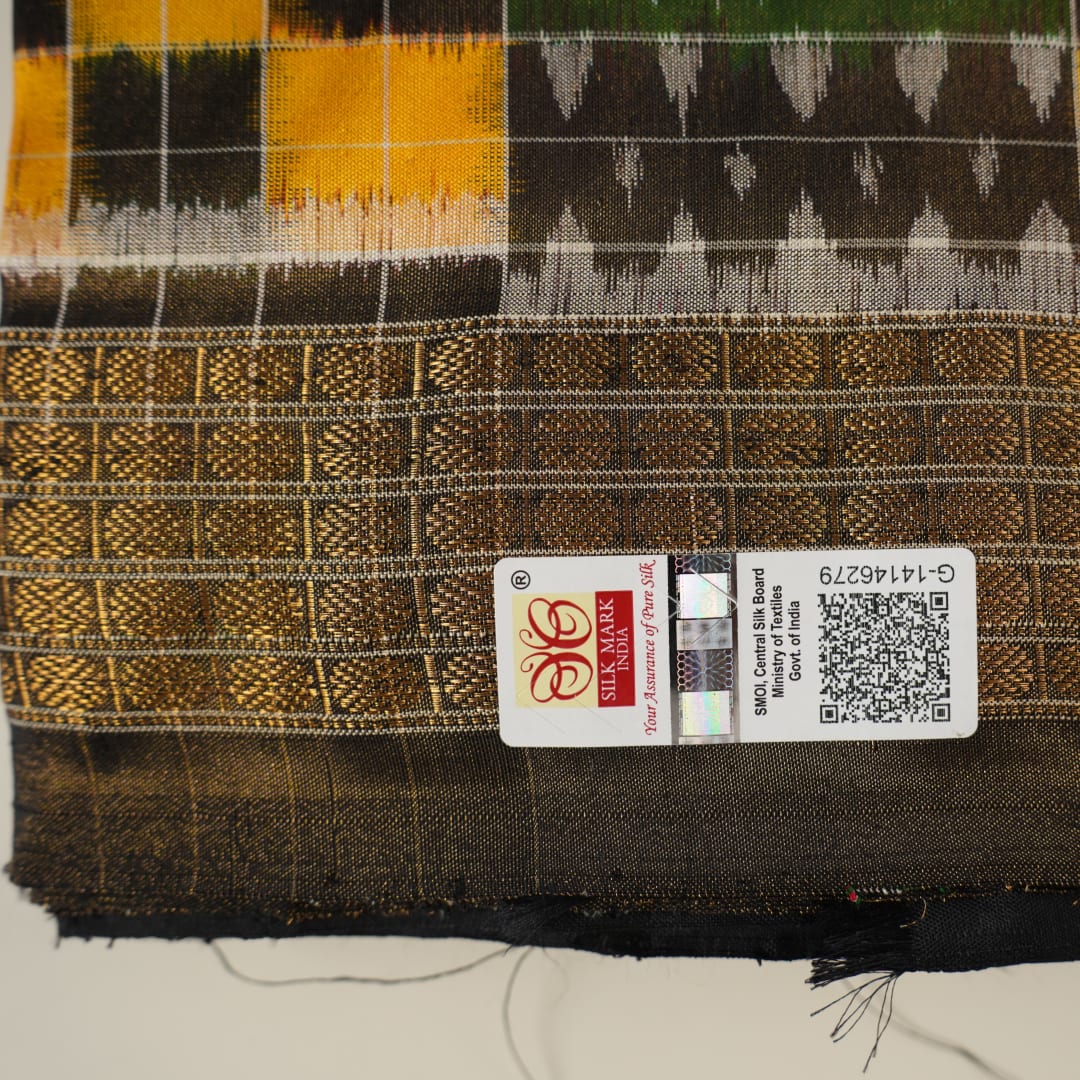 Extreme close-up of Sambalpuri Silk Saree fabric, revealing multi-color brown weave and tissue texture.