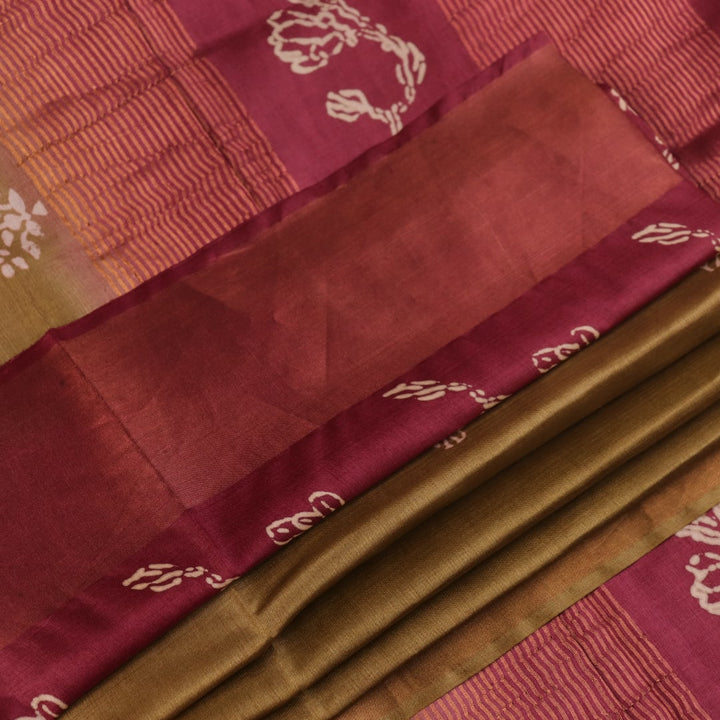 Close-up of the distinctive slub texture of a multi-color printed Tussar Silk saree.