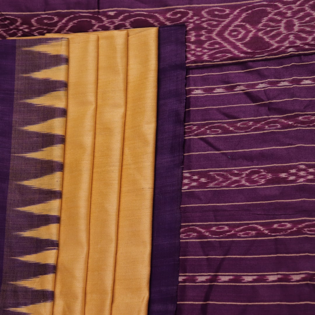 Close-up of cream tussar silk saree fabric with plain weave texture