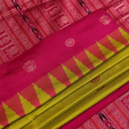 Close-up of green and magenta Bomkai silk saree fabric texture, highlighting intricate weave and butta pattern.