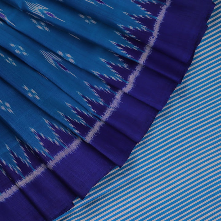 Full view of a blue Khandua silk saree featuring intricate motifs woven into the fabric.