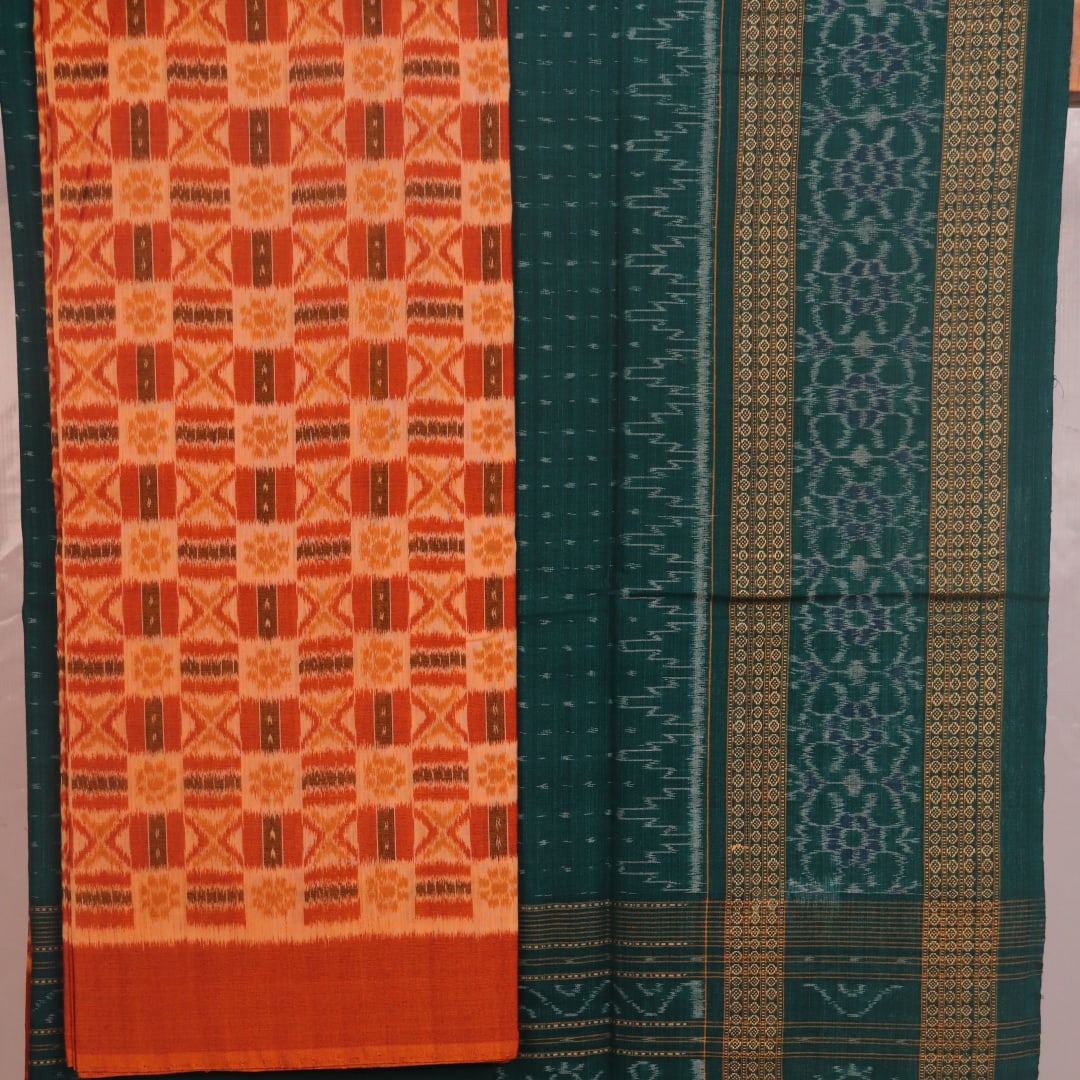 Blouse piece detail of the rust and green Sambalpuri cotton dress material with motifs.
