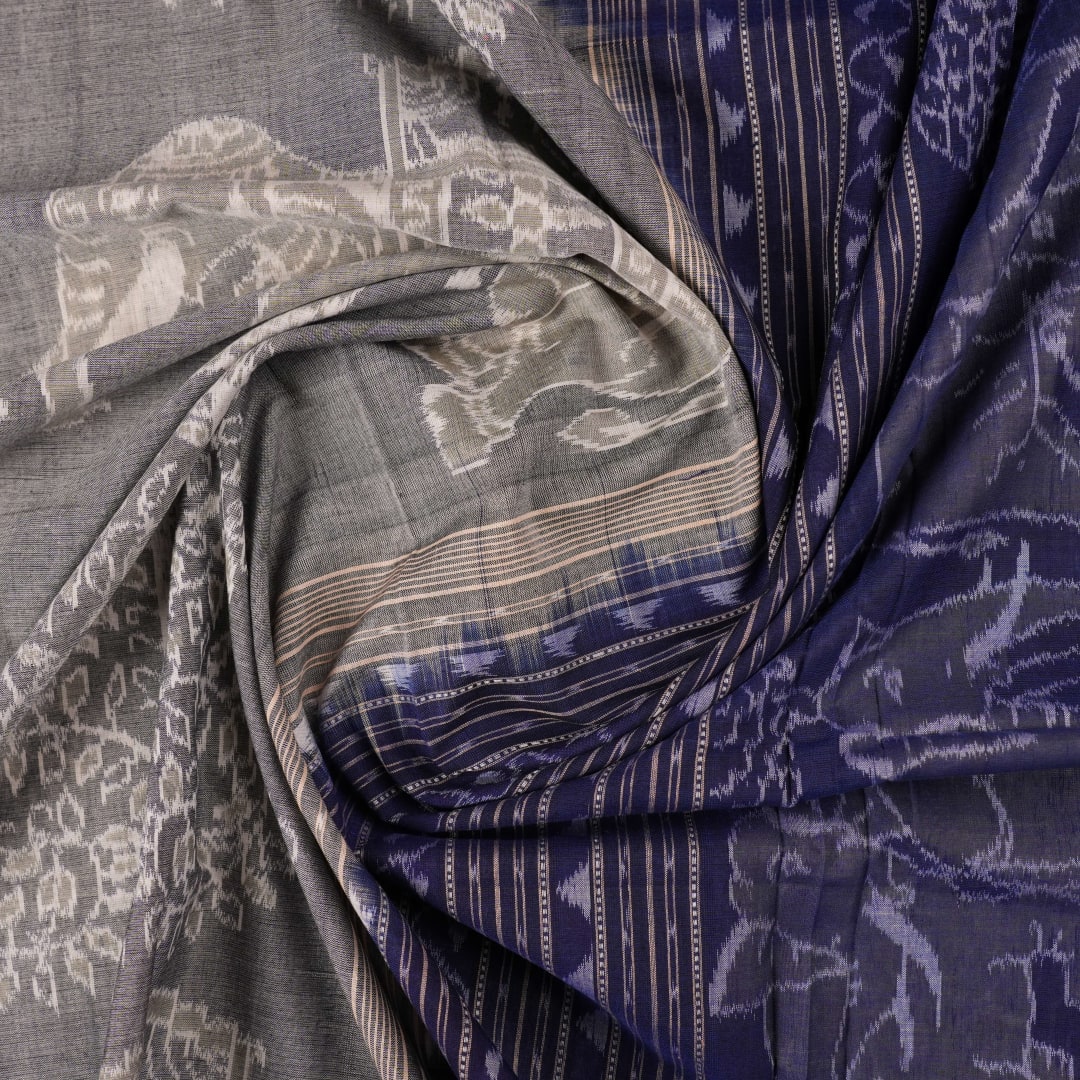 Full layout of the grey and blue Sambalpuri cotton saree displaying the body, border, and intricate pallu