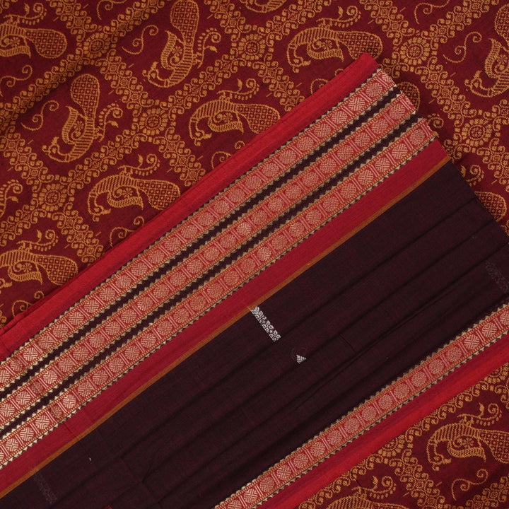 Full view of the maroon Bomkai cotton saree with red borders and small butta motifs laid out flat.
