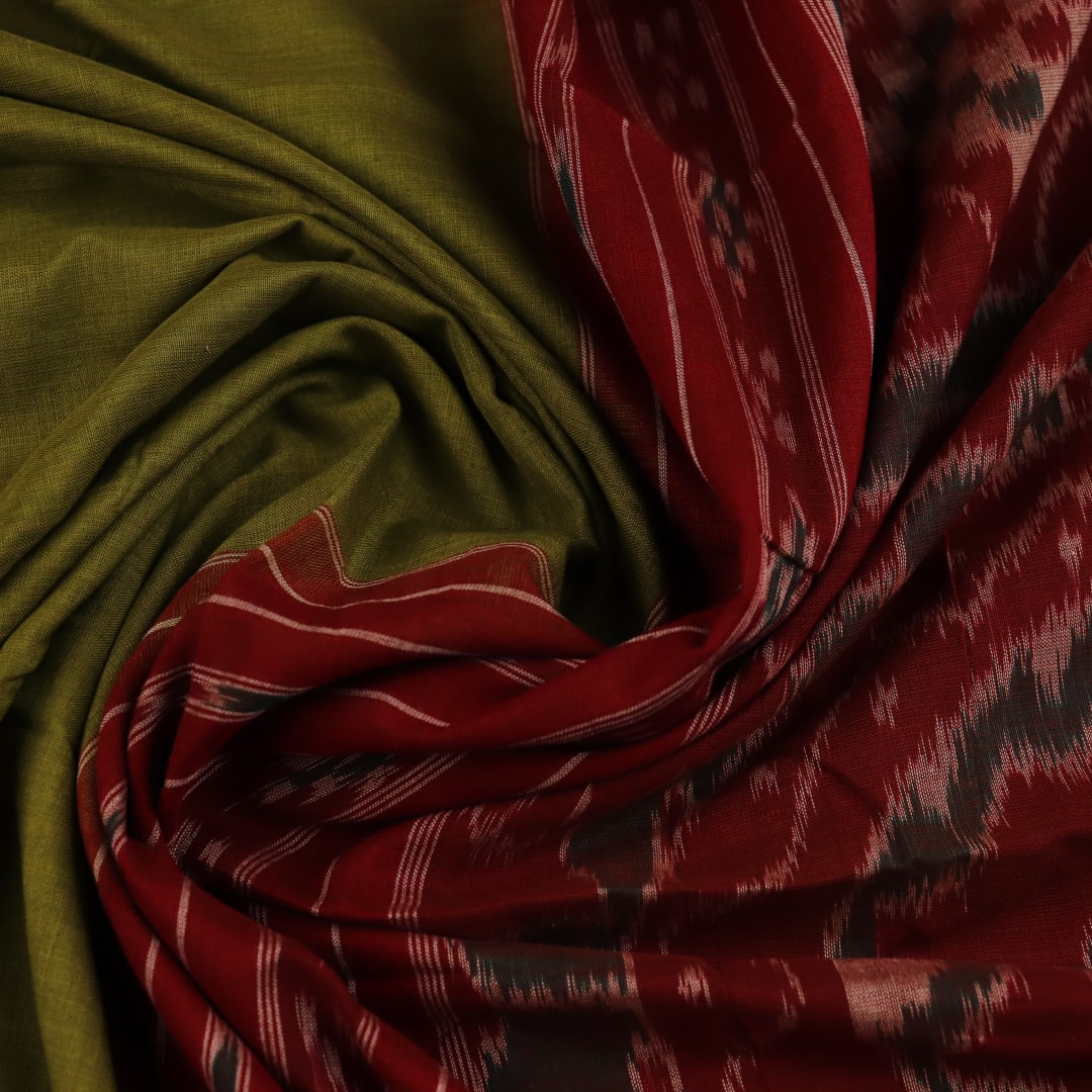 Green and maroon cotton Sambalpuri saree draped on a model, showcasing the Pasapalli pattern.