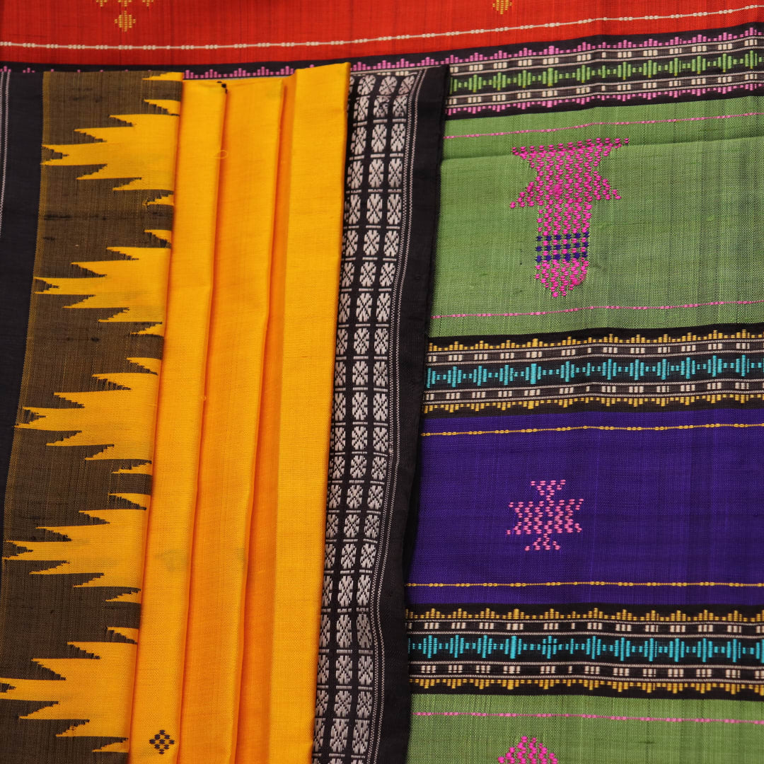 Close-up view of the golden silk fabric with black butta pattern of a Berhampuri silk saree