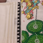 Close-up of white silk Patachitra saree fabric showing hand-painted texture and detail.
