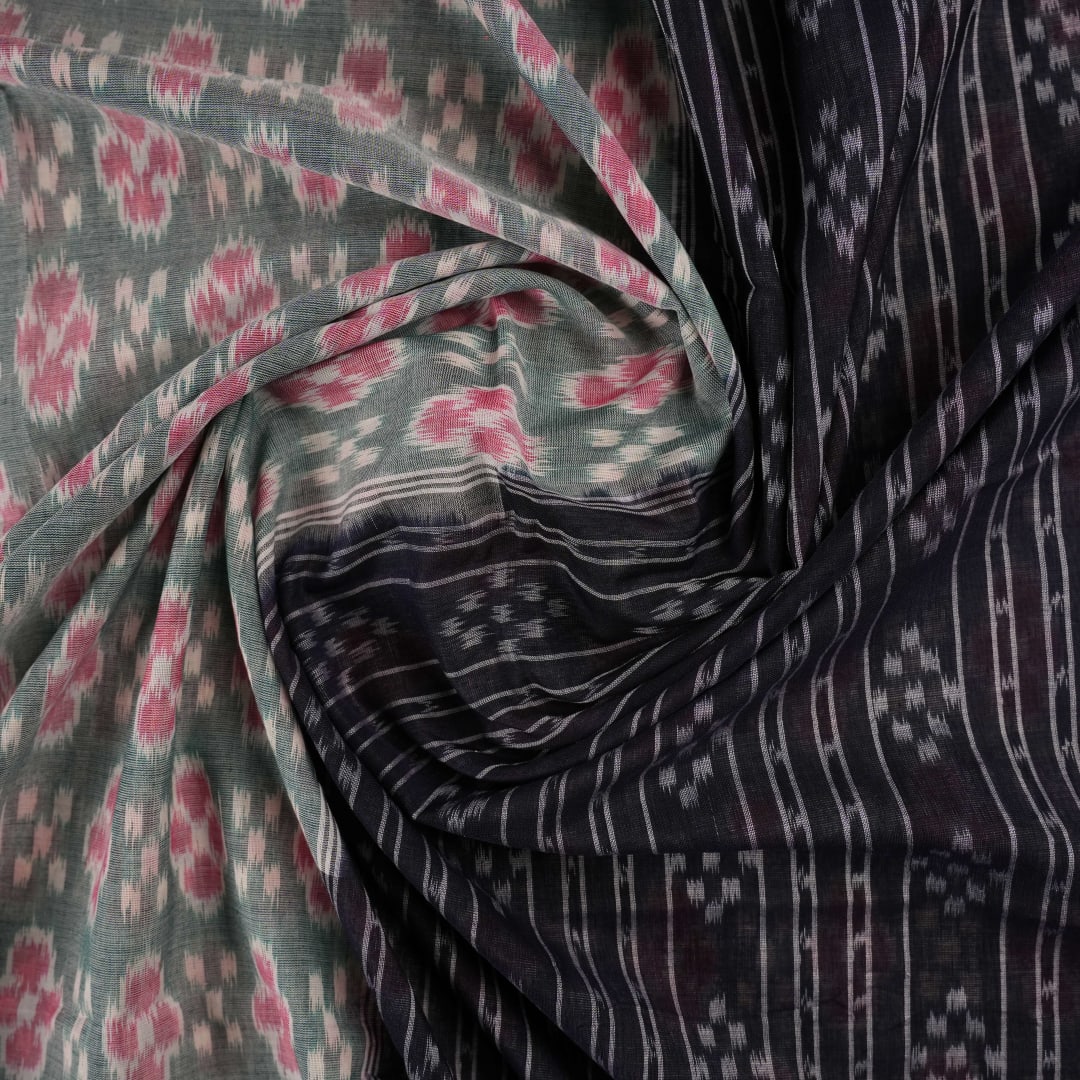 Model wearing a green and black Sambalpuri cotton saree showcasing traditional handloom drape and motifs.