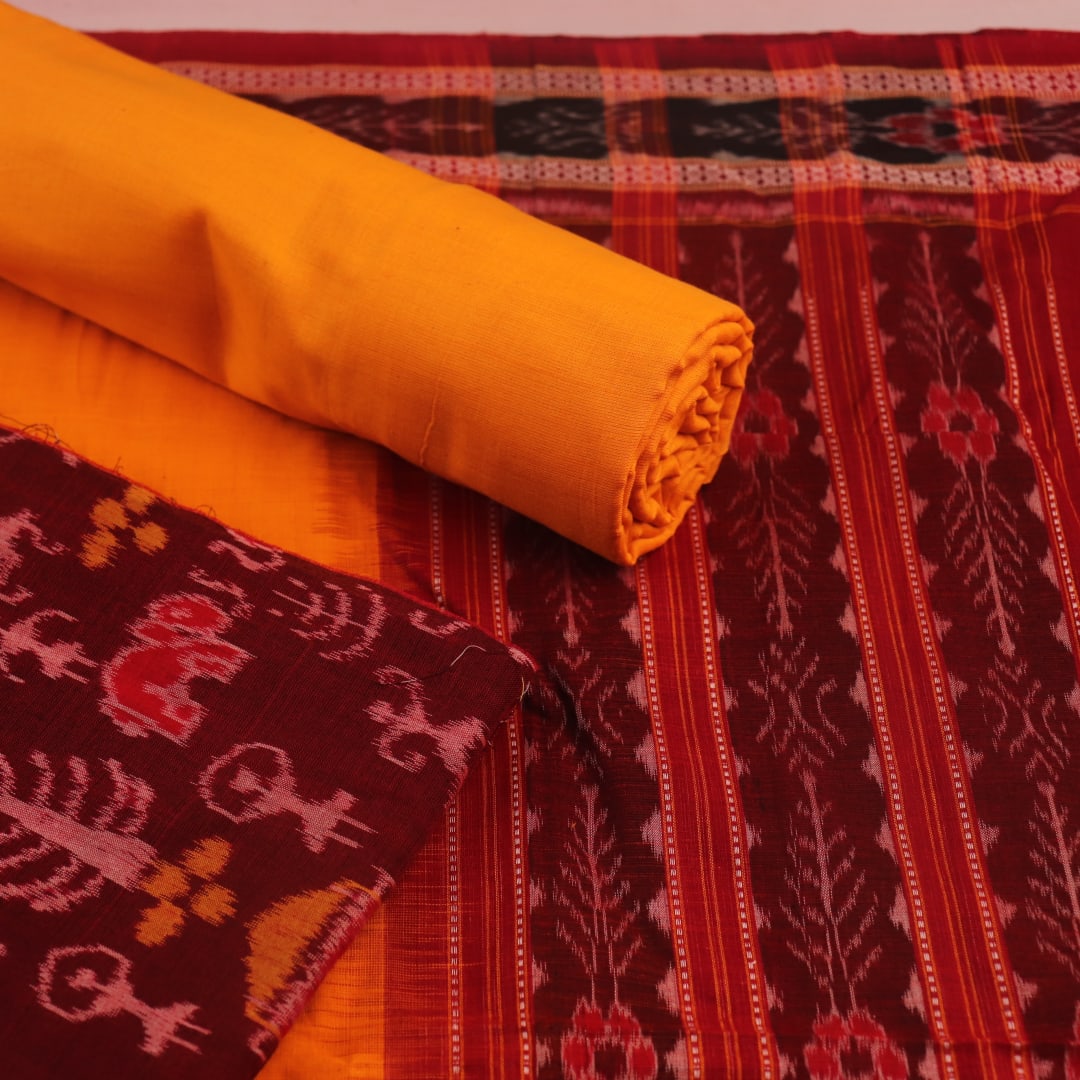 Detail of Sambalpuri cotton dress material blouse piece, maroon and yellow motifs.
