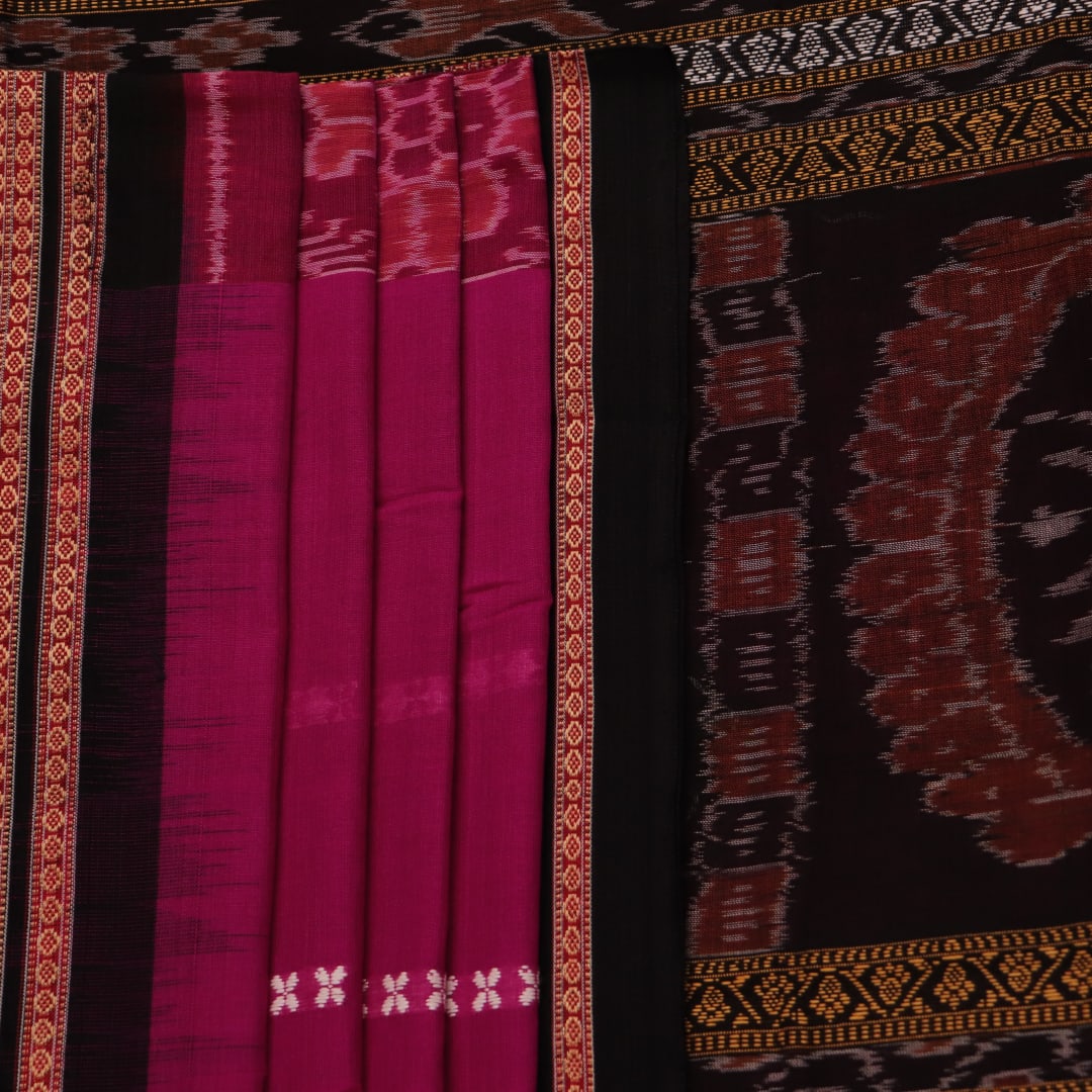 A full-length view of a vibrant magenta cotton Bomkai saree adorned with intricate black motifs.