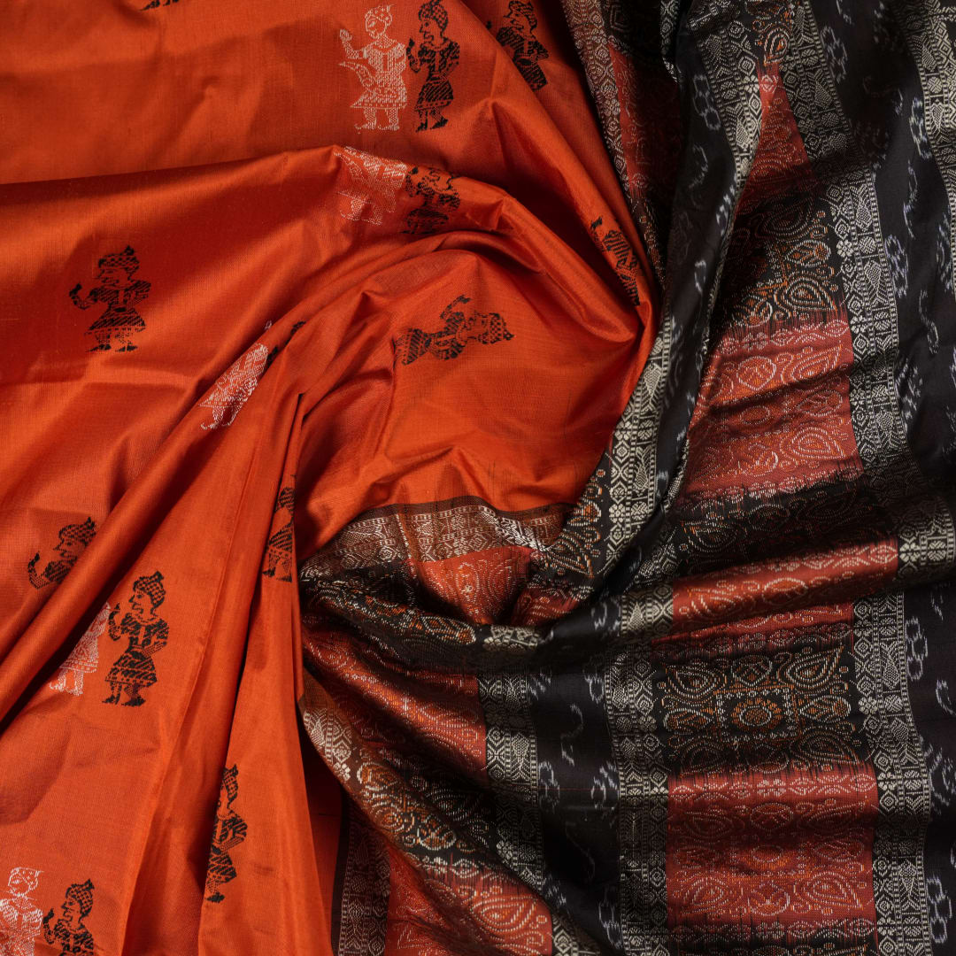 Ultra close-up of Bomkai Silk Saree fabric, revealing intricate handloom texture and butta weave details.